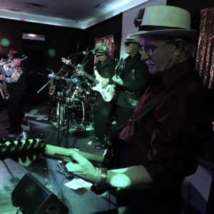 Live band performing on stage with guitarist