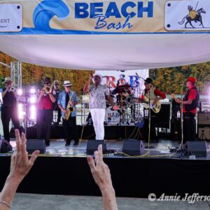 Band performing at outdoor Beach Bash event.